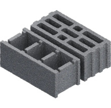 Zwei graue Mauersteine aus Beton mit Hohlräumen