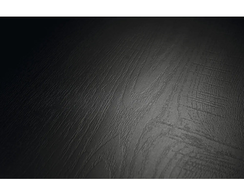 Nahaufnahme einer Oberfläche mit dunkler Holzstruktur und fühlbarer Maserung.