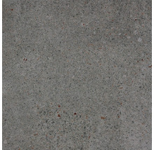 Nahaufnahme einer grauen Bodenfliese mit gesprenkelter Textur