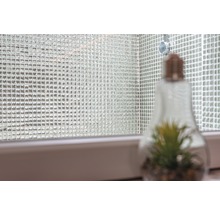 Mosaikfliesenwand mit dekorativer Glühbirne mit Pflanze