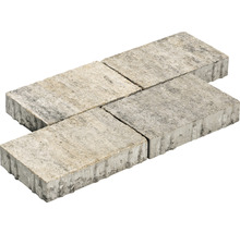 Vier graue Pflastersteine aus Beton