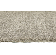 Nahaufnahme eines hellen Teppichs mit Schlingenstruktur