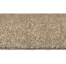 Nahaufnahme eines beigefarbenen Teppichs