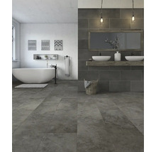 Modernes Badezimmer mit freistehender Badewanne, Waschtisch und grauen Fliesen