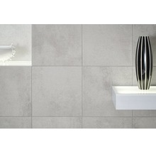 Wandgestaltung mit grauen Fliesen und Dekor