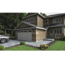 Außenansicht eines zweistöckigen Hauses mit Garage, Steintreppe und gepflegtem Rasen