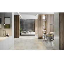 Heller Wohnraum mit Fliesenboden, Sofa und Essbereich