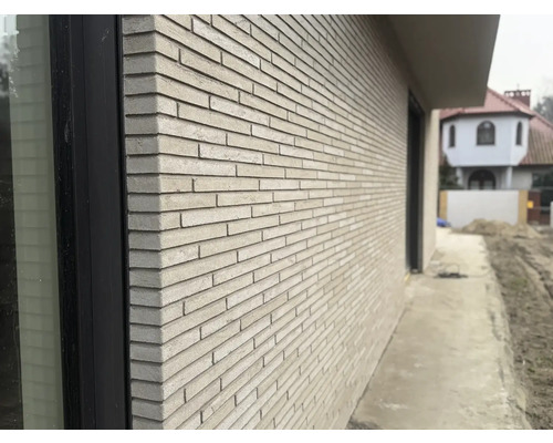 Produktbild 10 (groß) Außenaufnahme eines Gebäudes mit Fassade aus Ziegelsteinen.