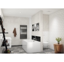 Badezimmer mit Badewanne, Toilette, Waschbecken und Heizkörper