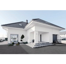 Modernes Haus mit dunklem Dach und gepflasterter Auffahrt