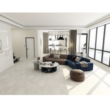 Modernes Wohnzimmer mit Ecksofa, Couchtisch und grossem Fenster