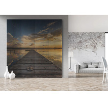 Wandbild mit Sonnenuntergangsmotiv in einem modern eingerichteten Wohnraum
