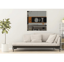 Dekoratives Wandbild mit Kassettenmotiv über einem Sofa