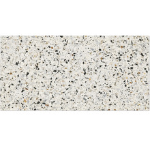 Nahaufnahme einer Terrazzo-Fliese mit kleinen, unregelmäßigen Steinsplittern