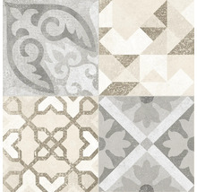 Bild von vier verschiedenen Fliesen mit geometrischen und floralen Mustern.