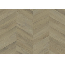 Laminatboden mit Holzoptik und Chevron-Muster.