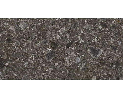 Nahaufnahme einer grauen Betonpflasterplatte mit Steineinschlüssen.