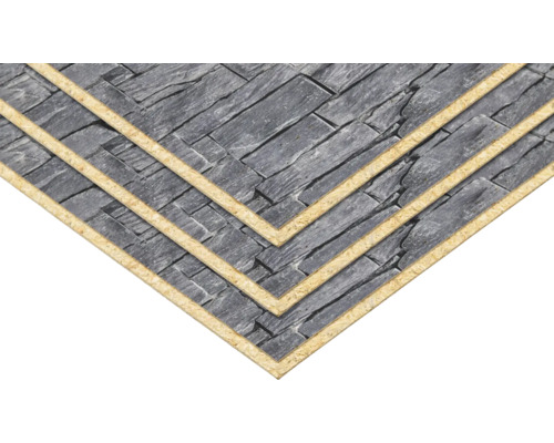 Wandpaneele in Steinoptik, mehrschichtig gestapelt, dunkles Grau, strukturierte Oberfläche.