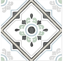 Dekorative Fliese mit symmetrischem Ornamentmuster, einem zentralen Blumenmotiv und rautenförmiger Umrandung.