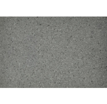 Gesprenkelte Oberfläche einer Bodenfliese oder Terrassenplatte in Steinoptik.