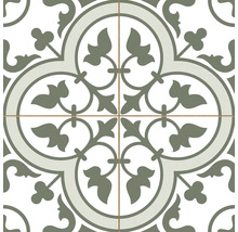 Dekorfliese mit symmetrischem Ornamentmuster aus Blättern und Ranken, das ein zentrales kreisförmiges Motiv bildet.