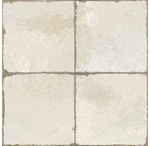 Vier beige Fliesen bilden ein Quadrat.