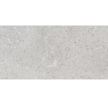 Nahaufnahme einer hellen, fein gemusterten Fliese.