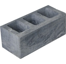Grauer Beton-Hohlblockstein mit drei Löchern