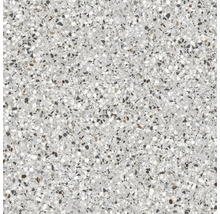 Nahaufnahme einer Terrazzo-Fliese mit kleinen Steineinschlüssen.