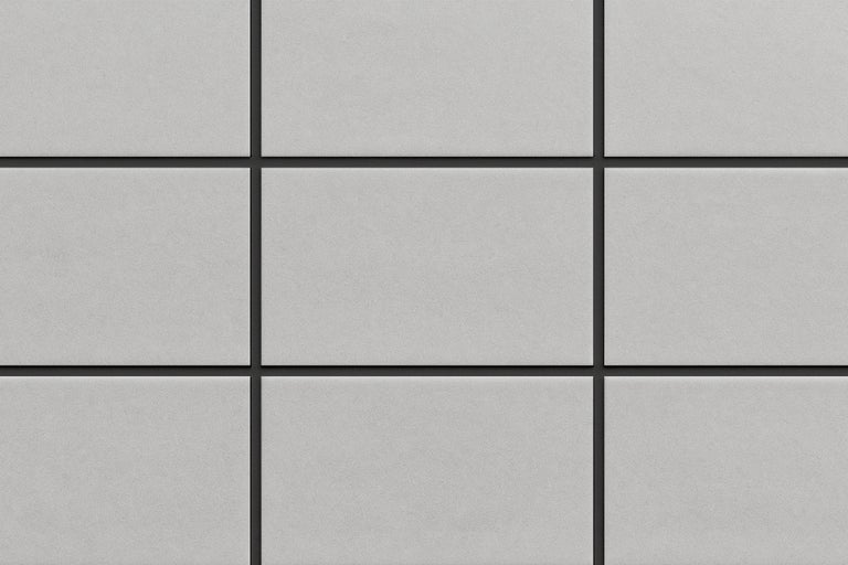 Nahaufnahme von quadratischen, grauen Wandfliesen mit dunklen Fugen