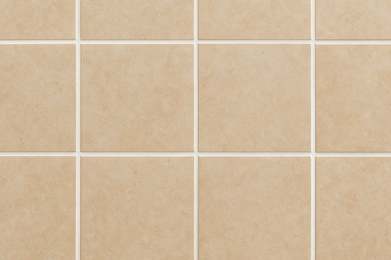 Beige Wandfliesen mit Fugen